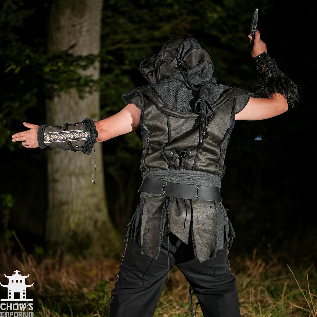 Back view of black LARP demon hunter set with hood, waistcoat, vambraces, sash.
