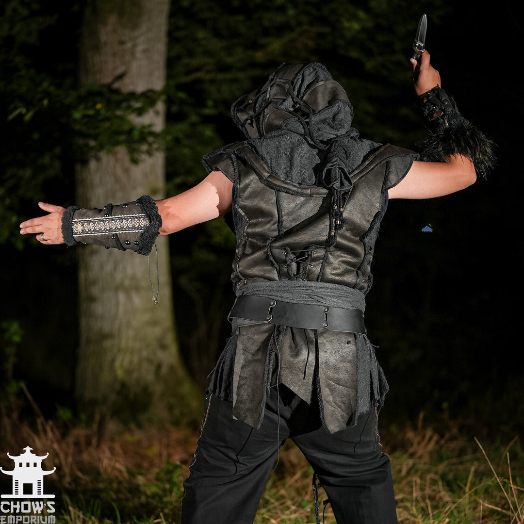 Back view of black LARP demon hunter set with hood, waistcoat, vambraces, sash.