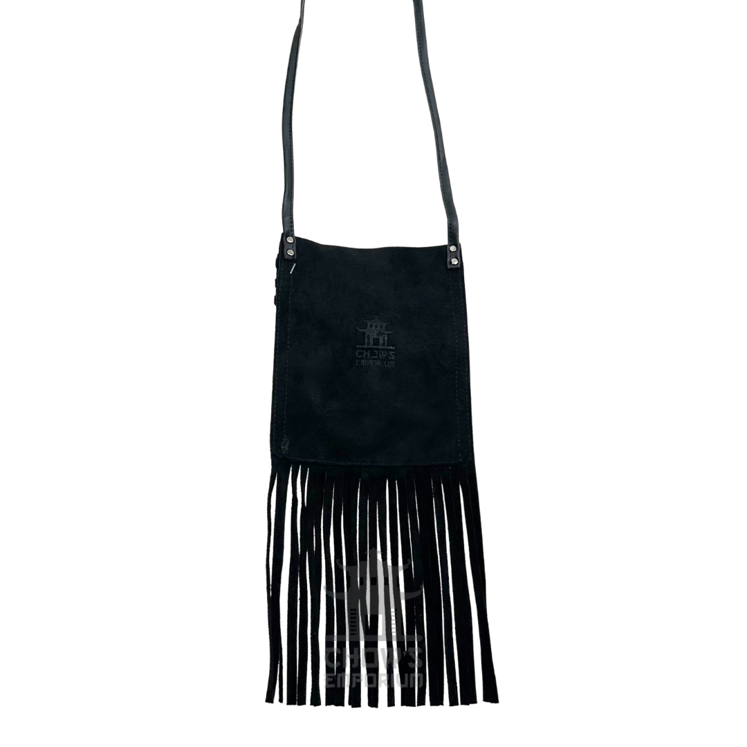 Black suede fringe flap bag showing fringe and long strap