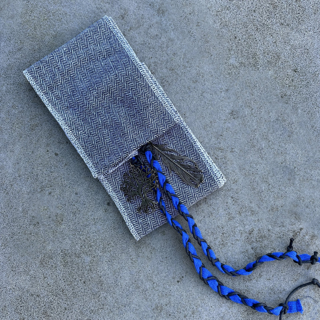 LARP medieval sash with herringbone pattern, blue braid detail visible.