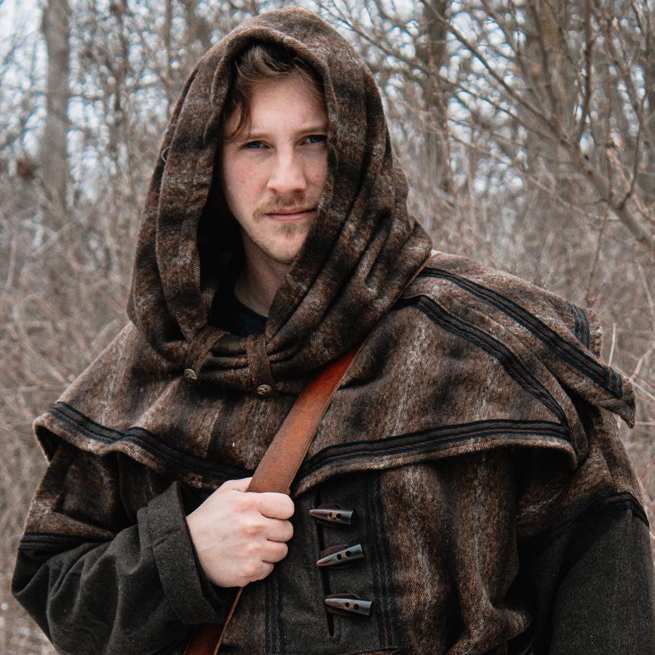 Brown mohair snood hood for LARP, front view in woodland setting.