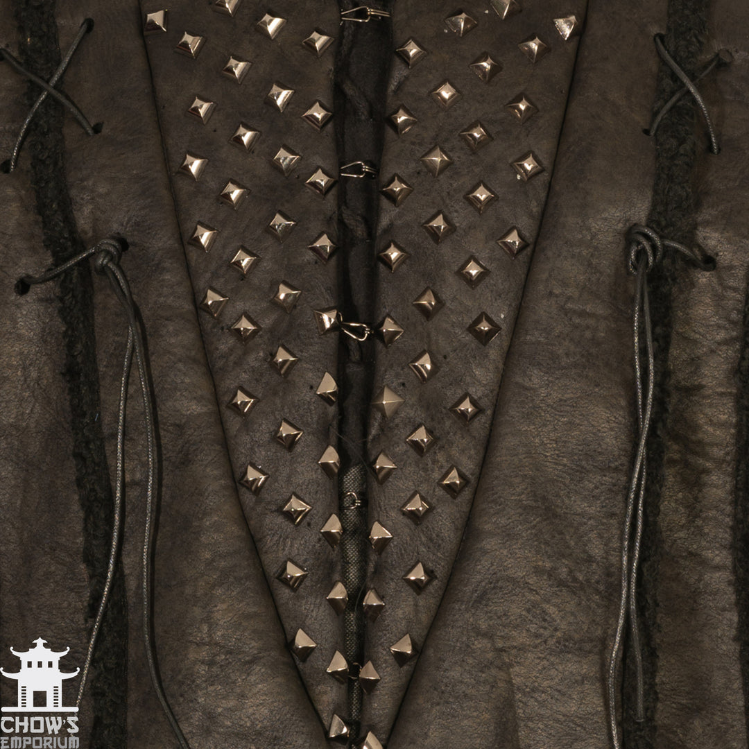 Close-up of studded medieval faux leather LARP jacket with lace details.
