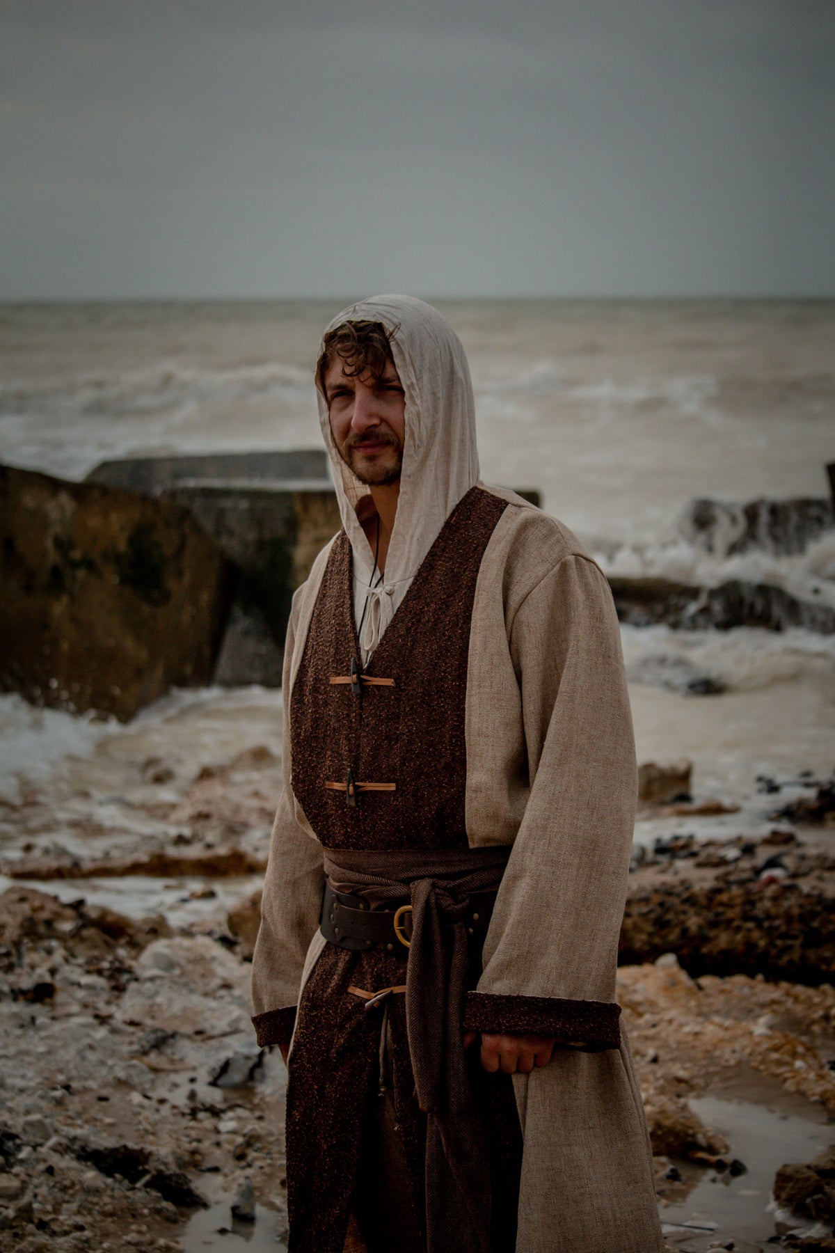 Hooded medieval shirt in natural linen, front view.