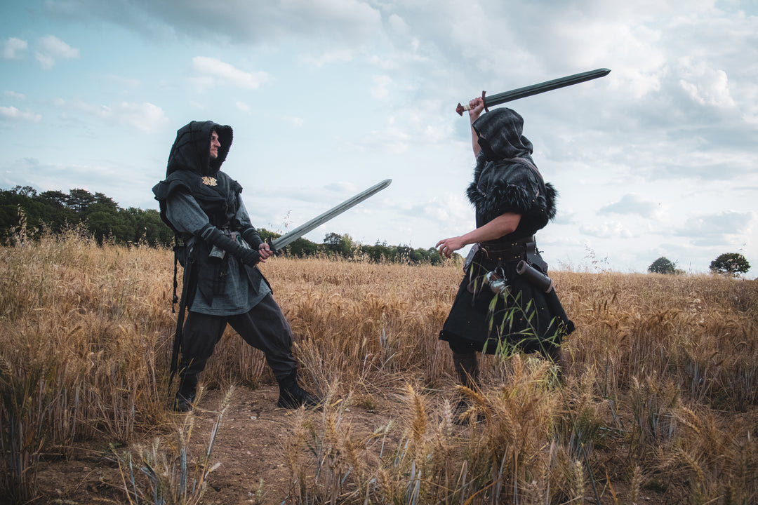 LARP barbarian armor with faux leather tunic and mohair hood in battle scene.
