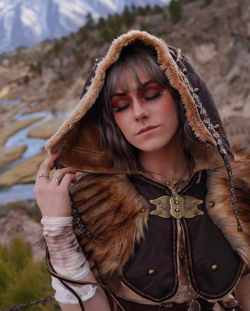 Brown ornate faux leather LARP hood with fur trim, frontal view.