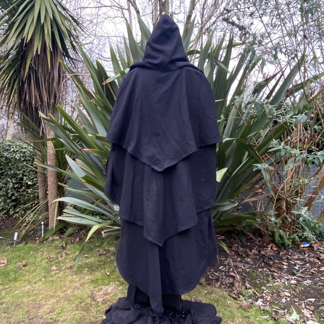 Black LARP cloak with hood, viewed from the back, cotton fabric, medieval style.