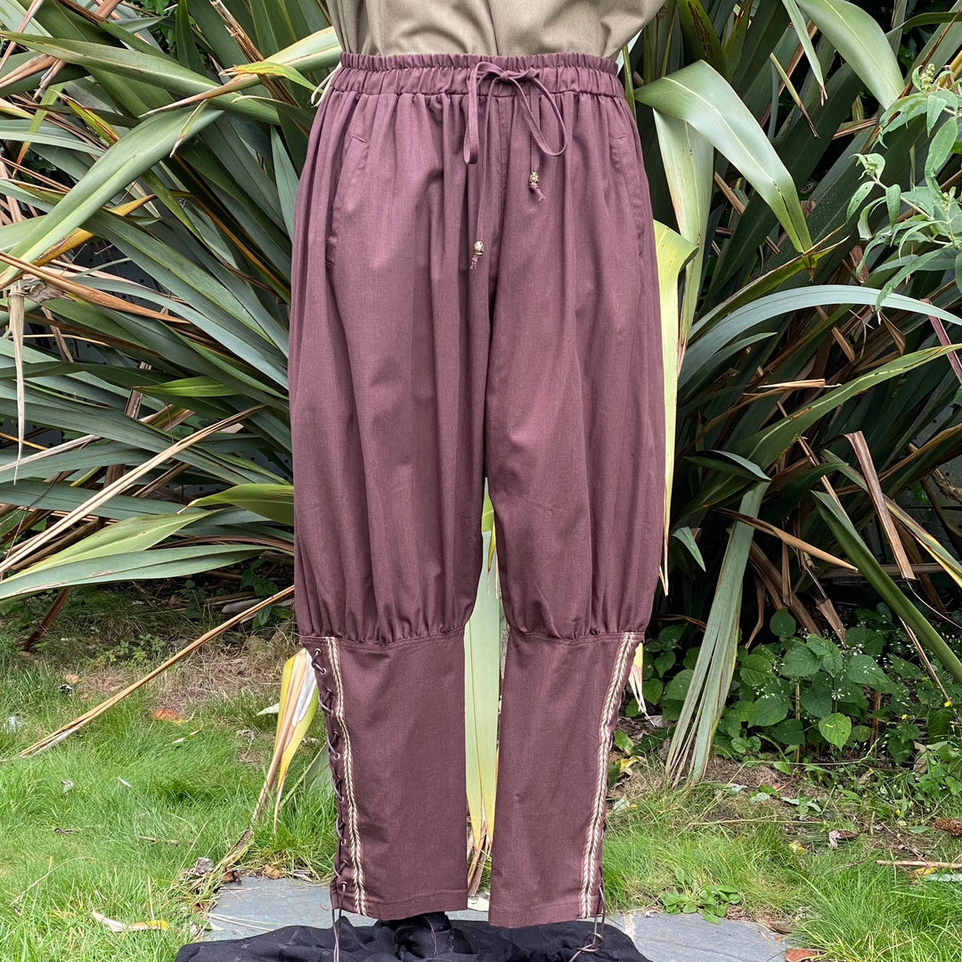 Brown medieval LARP pants with braided side detail.