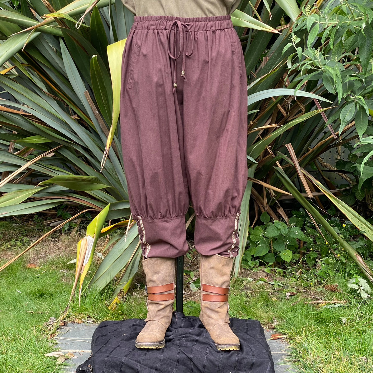 brown cotton viking pants with braiding for LARP.