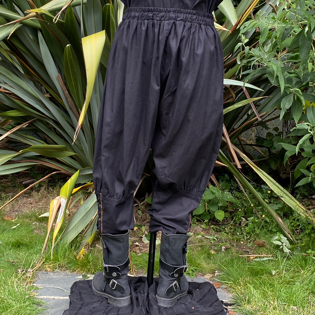 Black Viking pants with braided cuffs, medieval LARP.