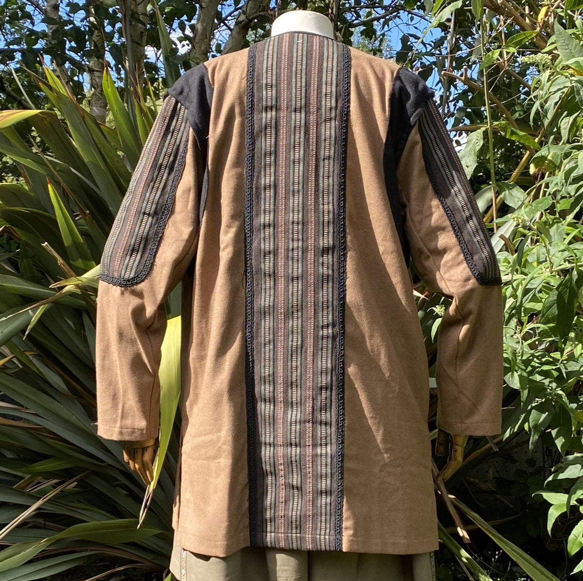 Rear view of medieval LARP jacket with striped back panel.
