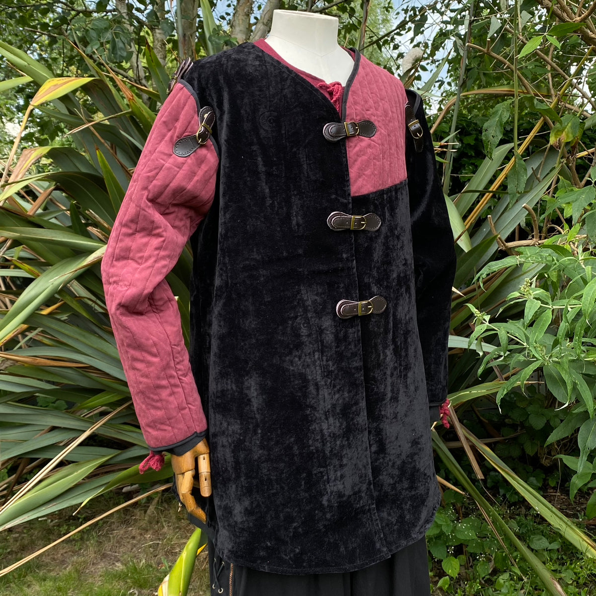 Black and red velvet medieval jacket with buckles.