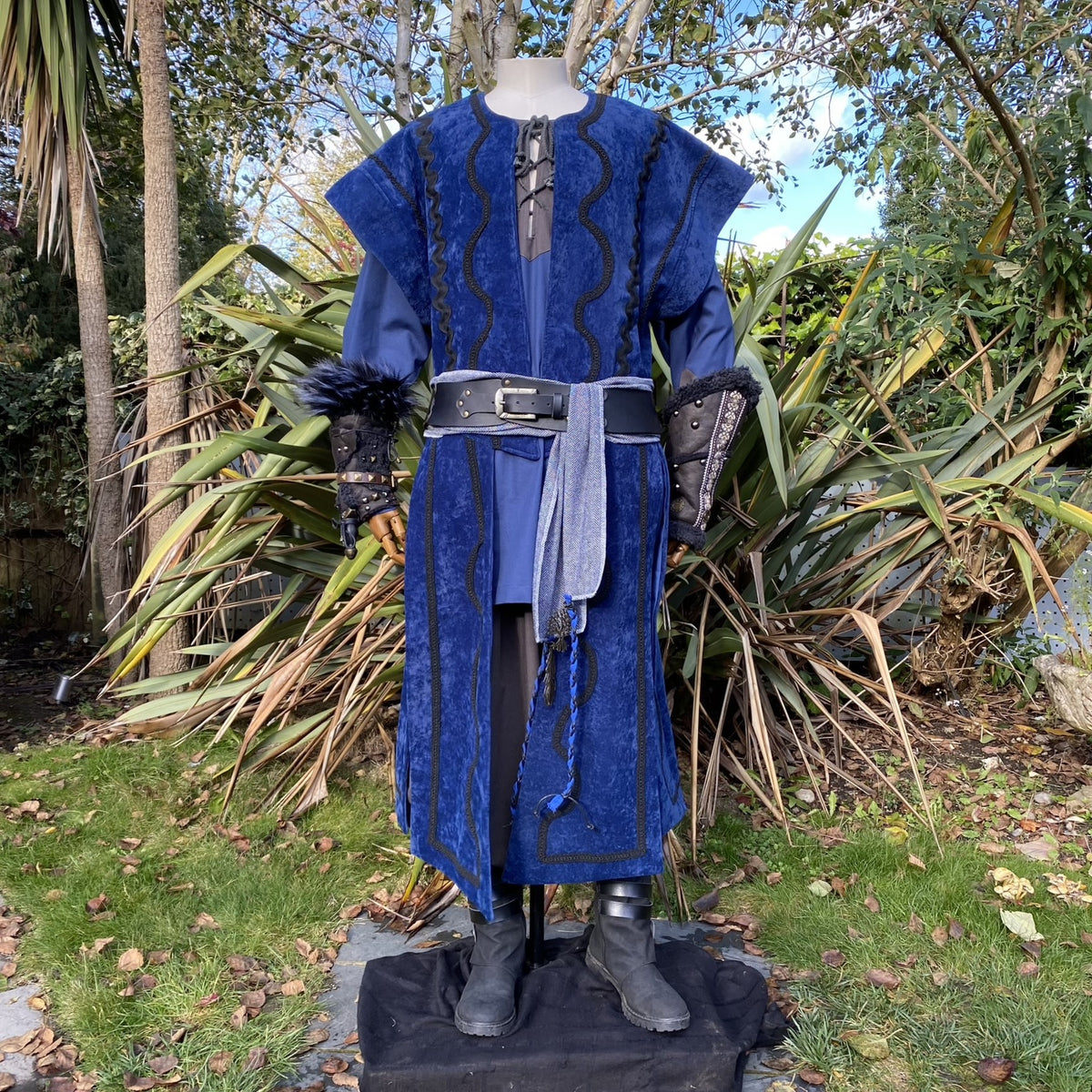 Blue velvet LARP waistcoat, hood, and black vambraces on mannequin.