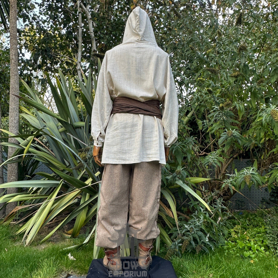Natural LARP medieval outfit: hooded shirt, pants, sash, rear view.