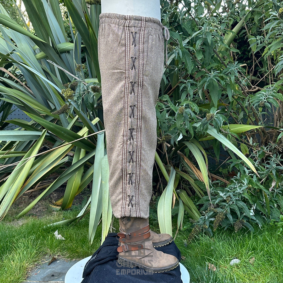 Brown medieval LARP pants with side stitching, worn with boots.