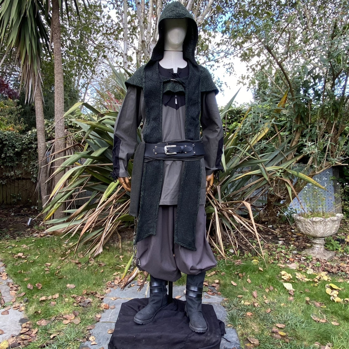 Medieval LARP outfit on mannequin, showcasing hooded vest and belt.