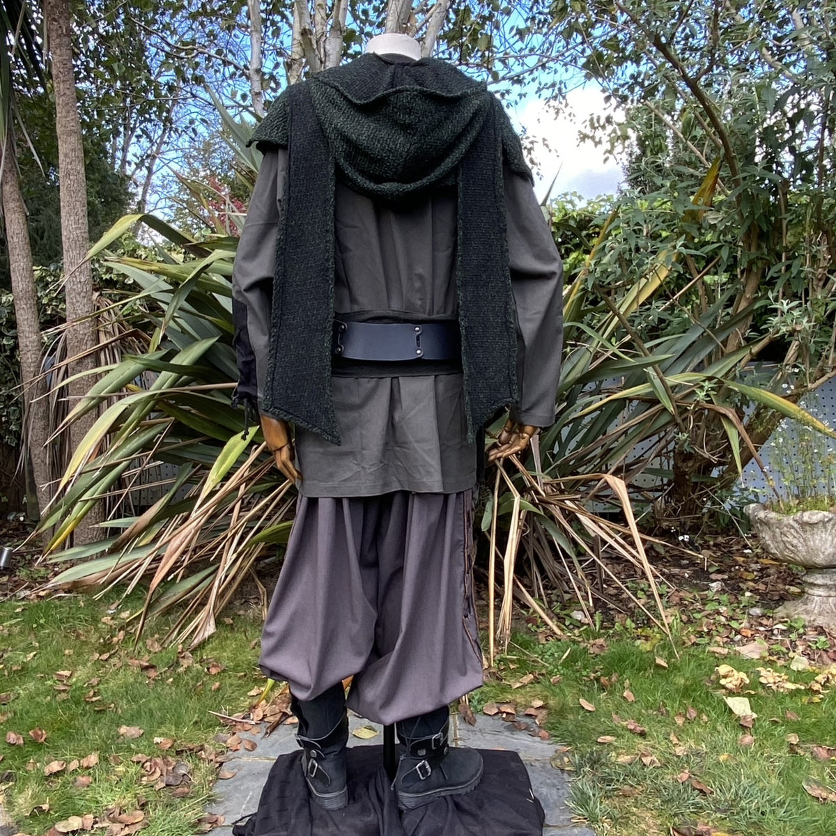 Back view of LARP outfit with green hooded scarf, medieval style.