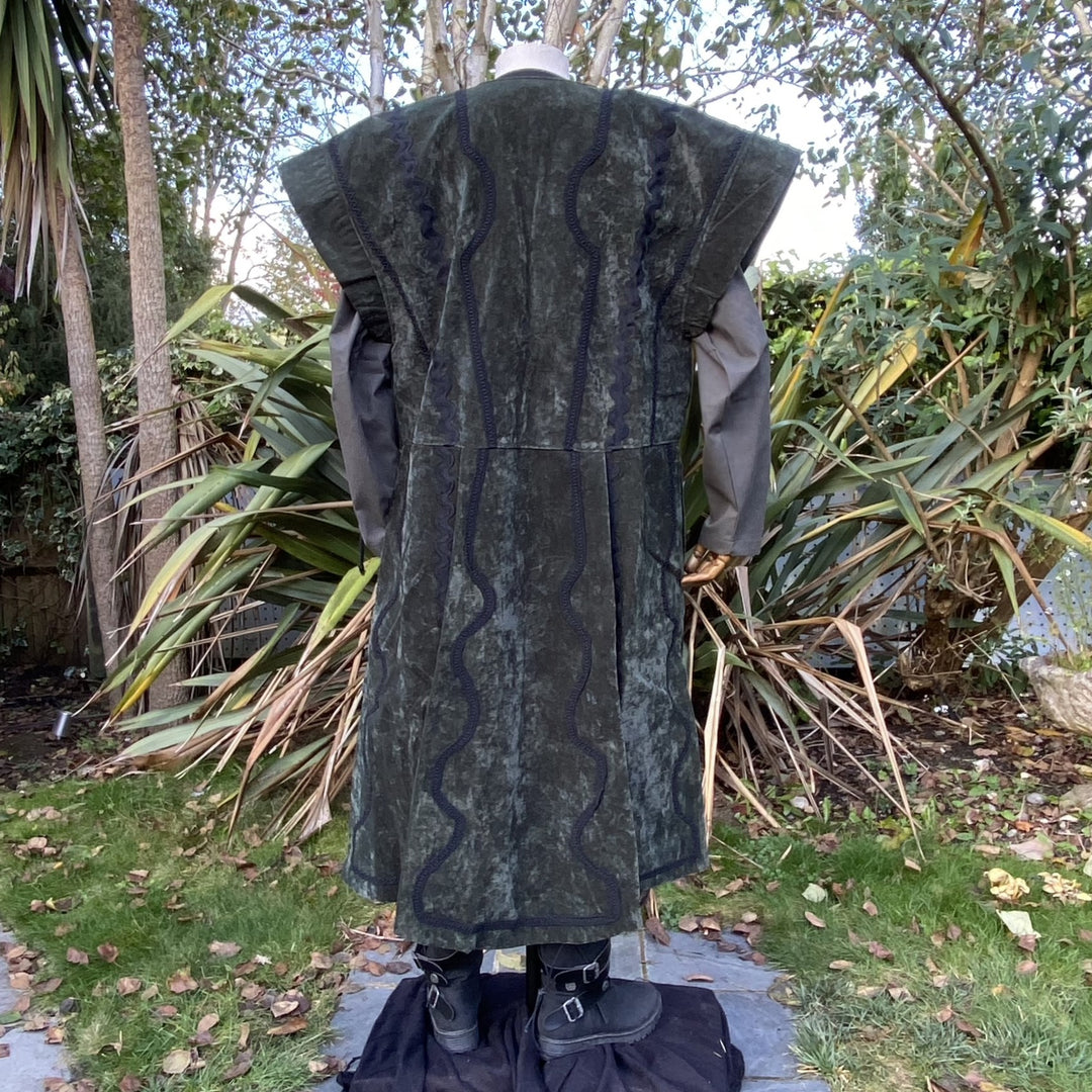 Rear view of green suede-effect LARP waistcoat with wavy black trim.