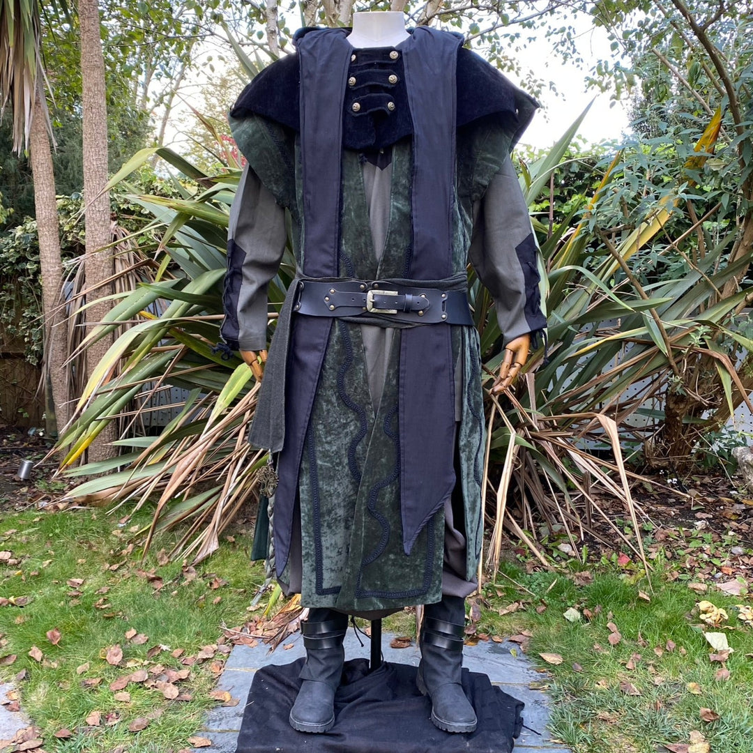 Detail shot of suede-effect texture and decorative braiding on green wizard waistcoat.