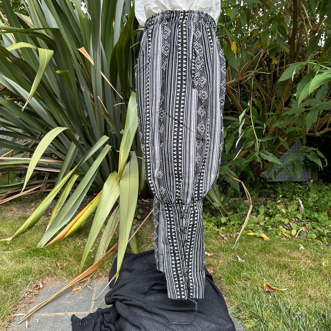 White medieval shirt with black patterned pants for LARP.