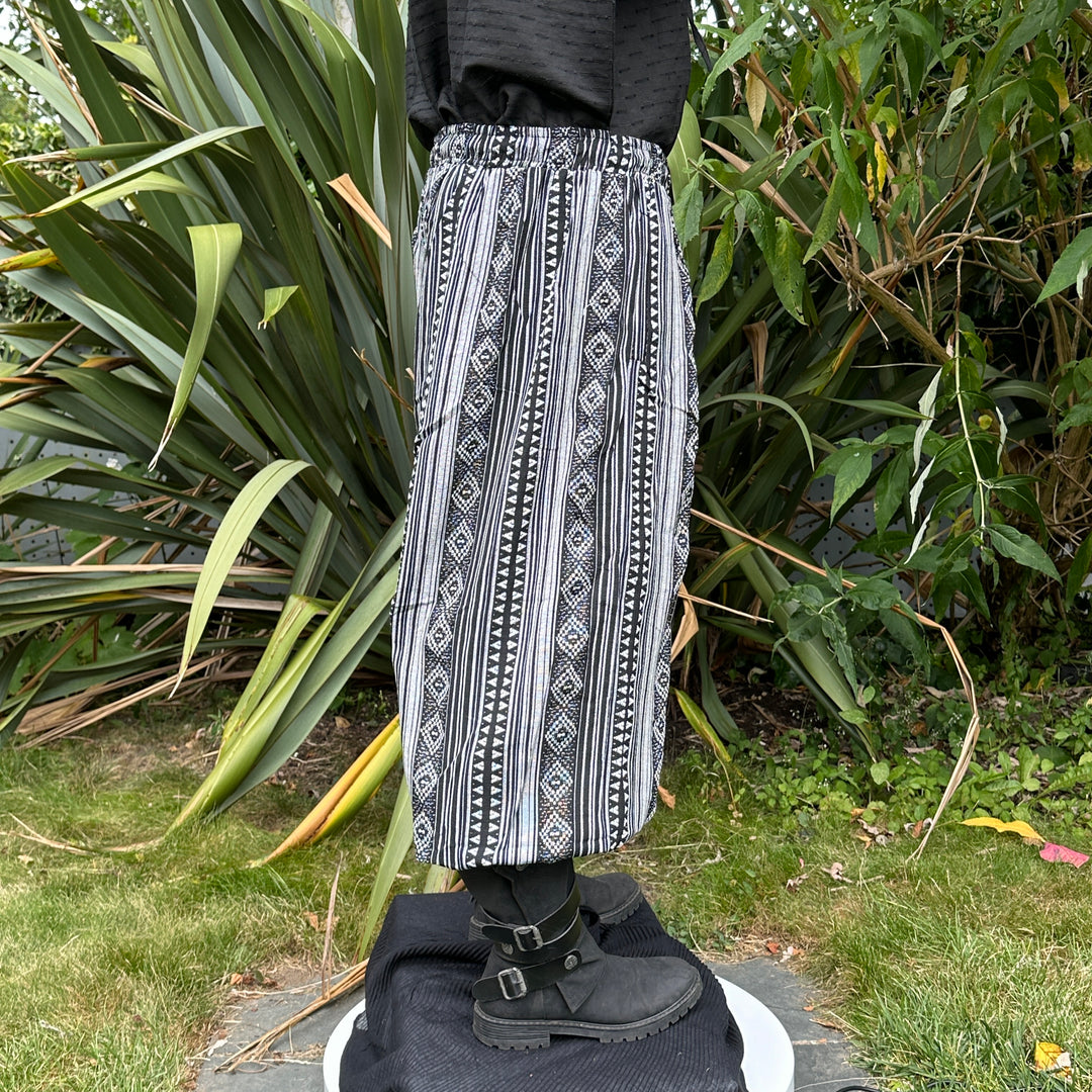 LARP black and white patterned trousers and sash, side view.