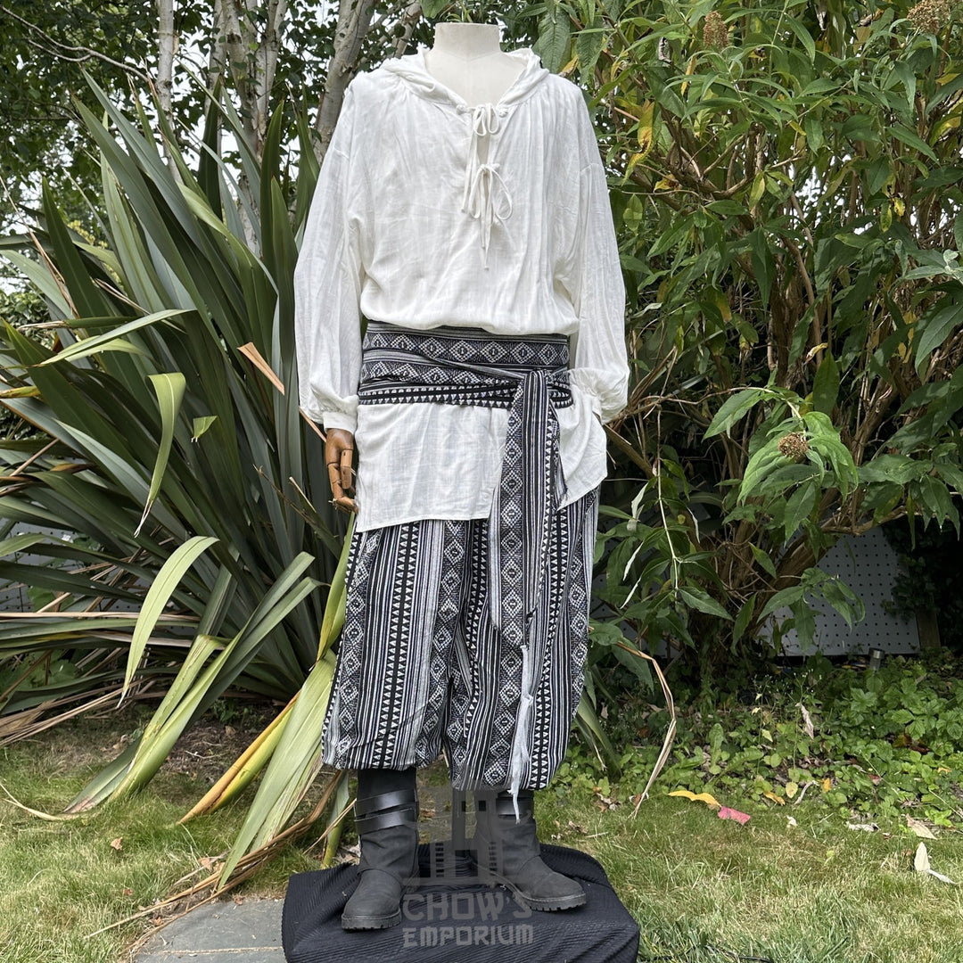 White hooded shirt with patterned sash and trousers for LARP costume.