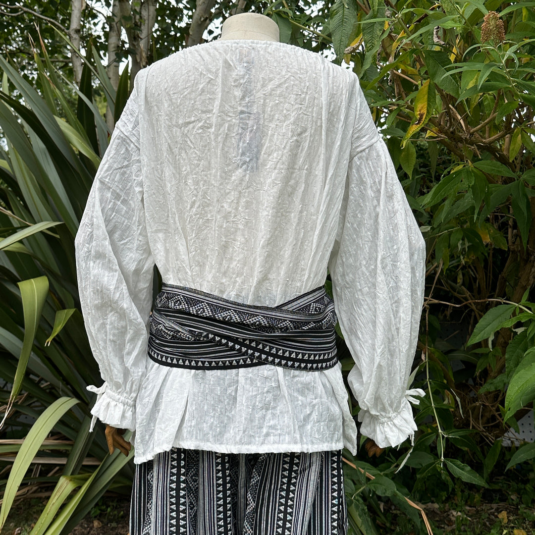 Black and white pirate sash with geometric patterns for LARP costume. Back view.