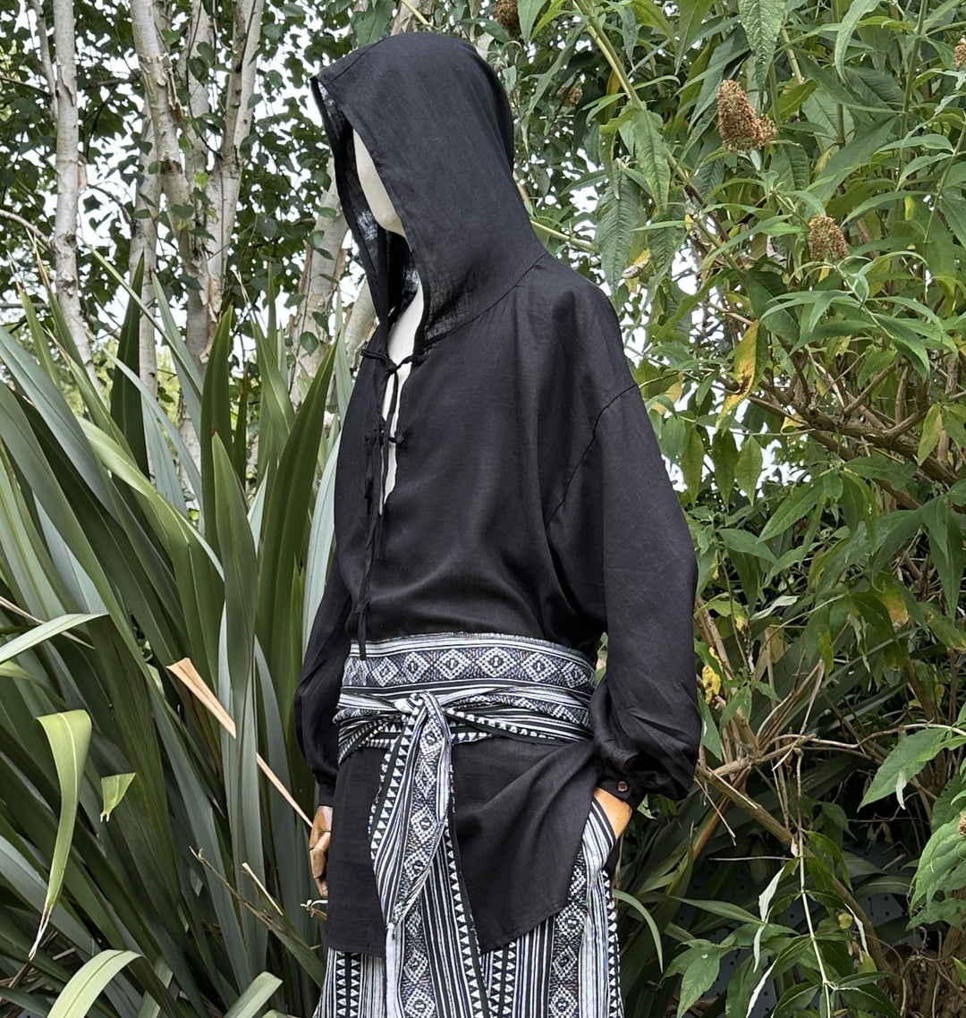 Black hooded LARP shirt with patterned belt.