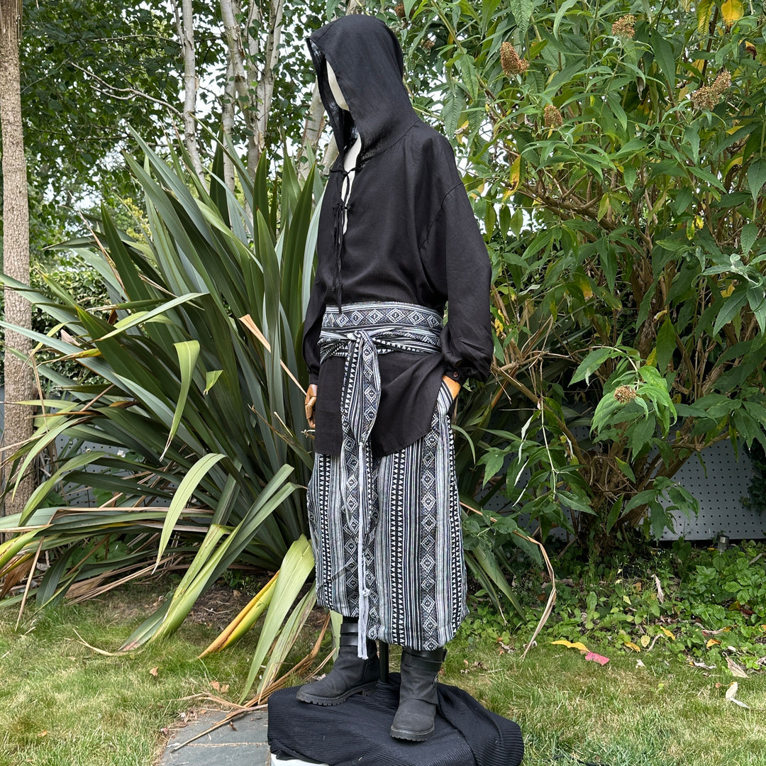 LARP black and white pirate sash in fabric, tied at waist, side view.