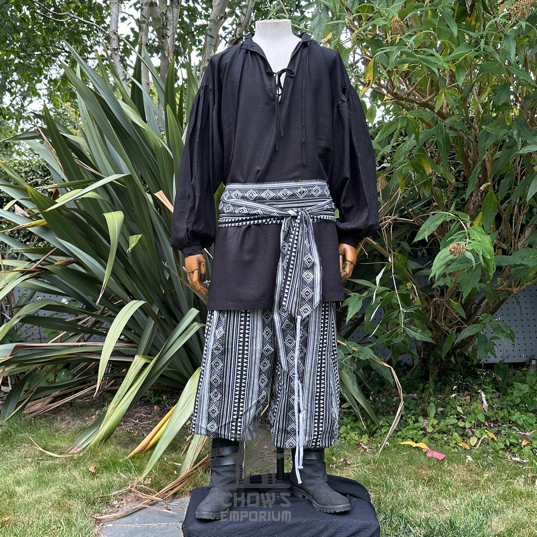 Black hooded LARP robe set with patterned trousers and sash, front view.