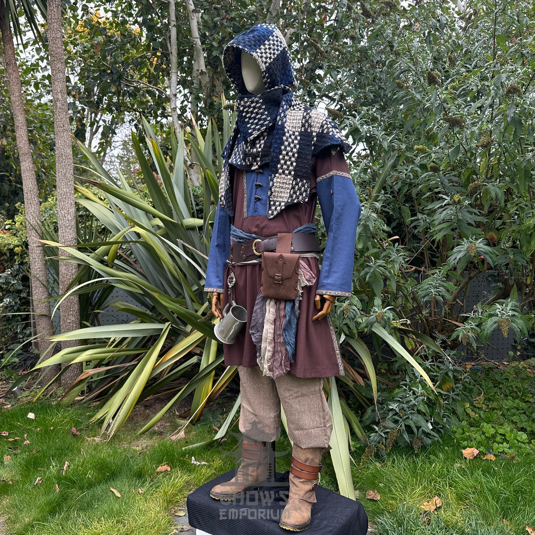 LARP medieval outfit, blue tunic, brown trousers, and checked hood.