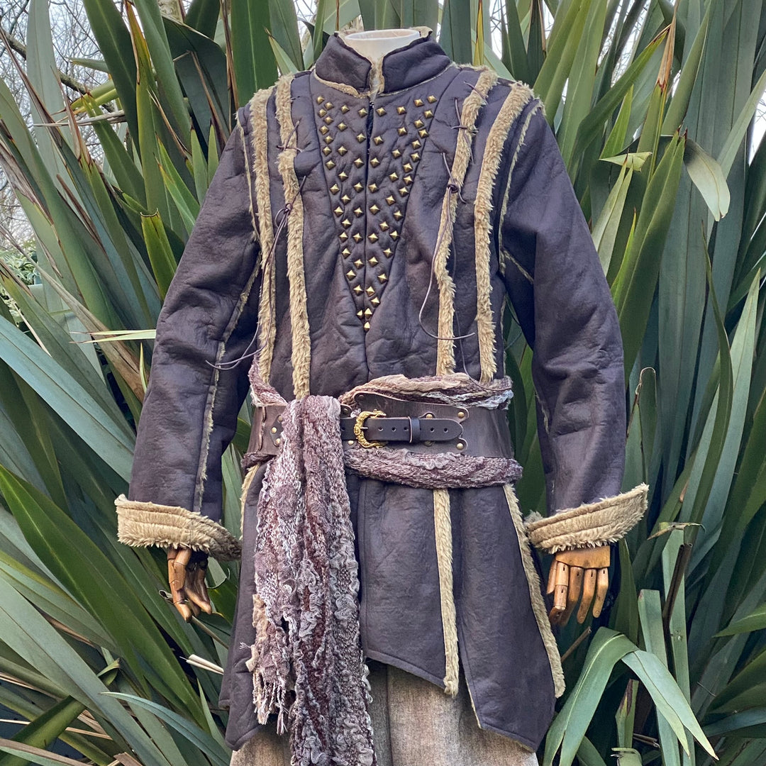 Dark medieval LARP jacket with studded front, wool trim, seen from front.