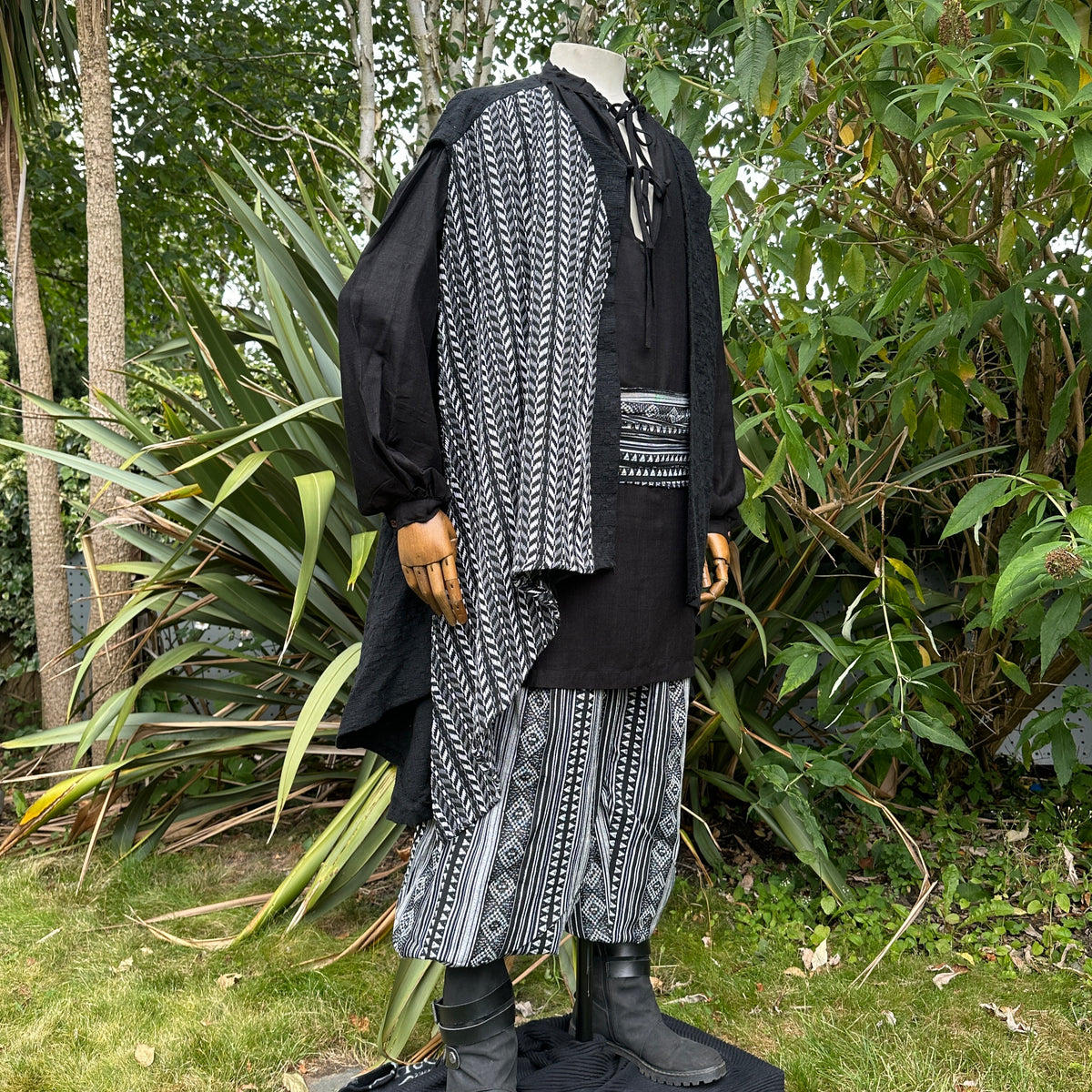 LARP medieval set with black patterned sash, waistcoat, shirt, and pants.