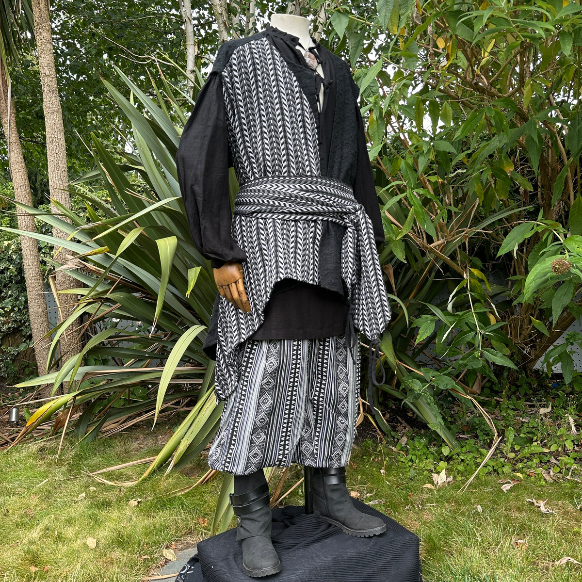 Medieval LARP outfit front view; patterned layers and boots.