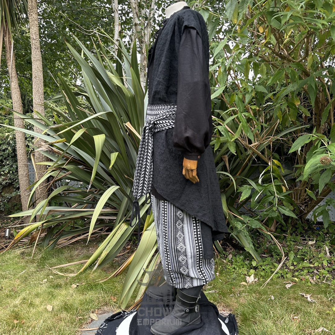 LARP pirate waistcoat in black, white sash, side view, medieval style.