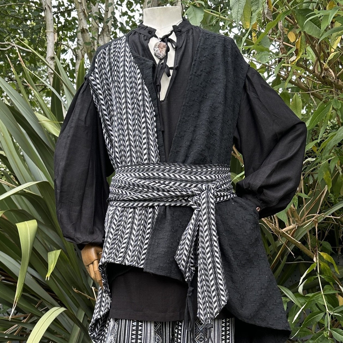 Black and white medieval LARP robe with sash and waistcoat, front view.