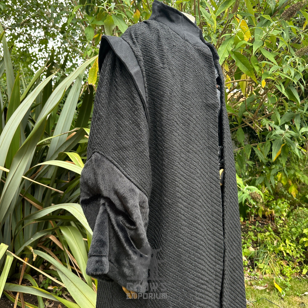 Black medieval LARP robe with textured fabric, side angle view.