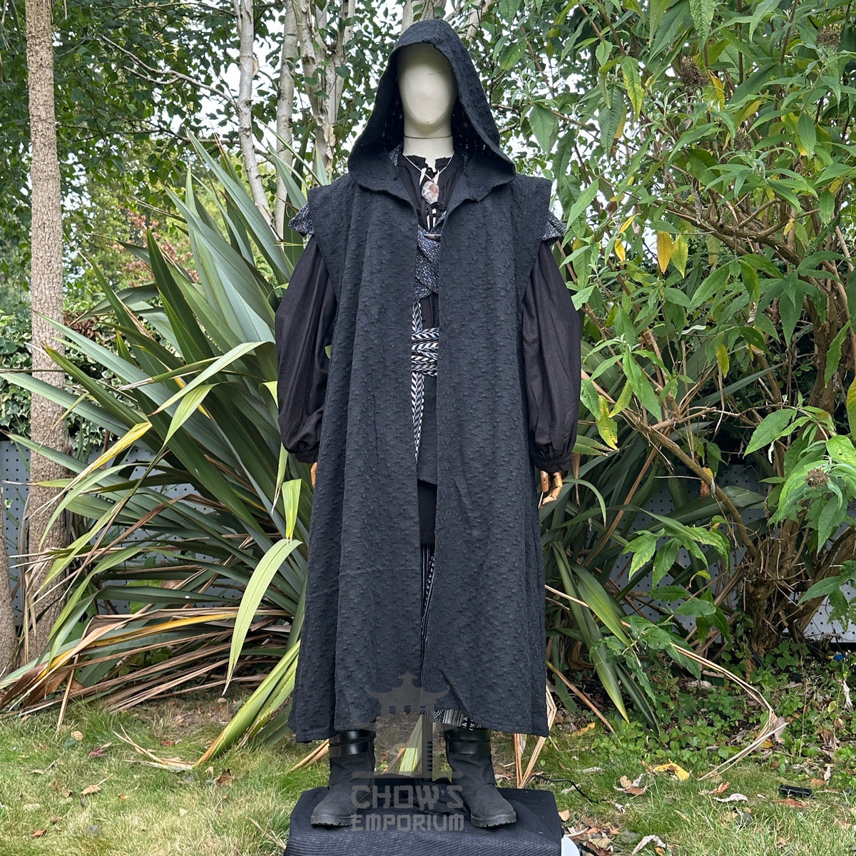 Medieval LARP costume front view featuring black sleeveless robe, hood, shirt, trousers, and sash.