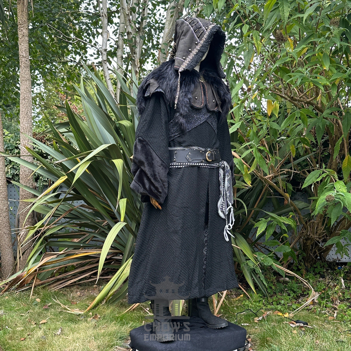 Medieval LARP costume side view featuring black robe, ornate hood, wool hood, belt and sash.