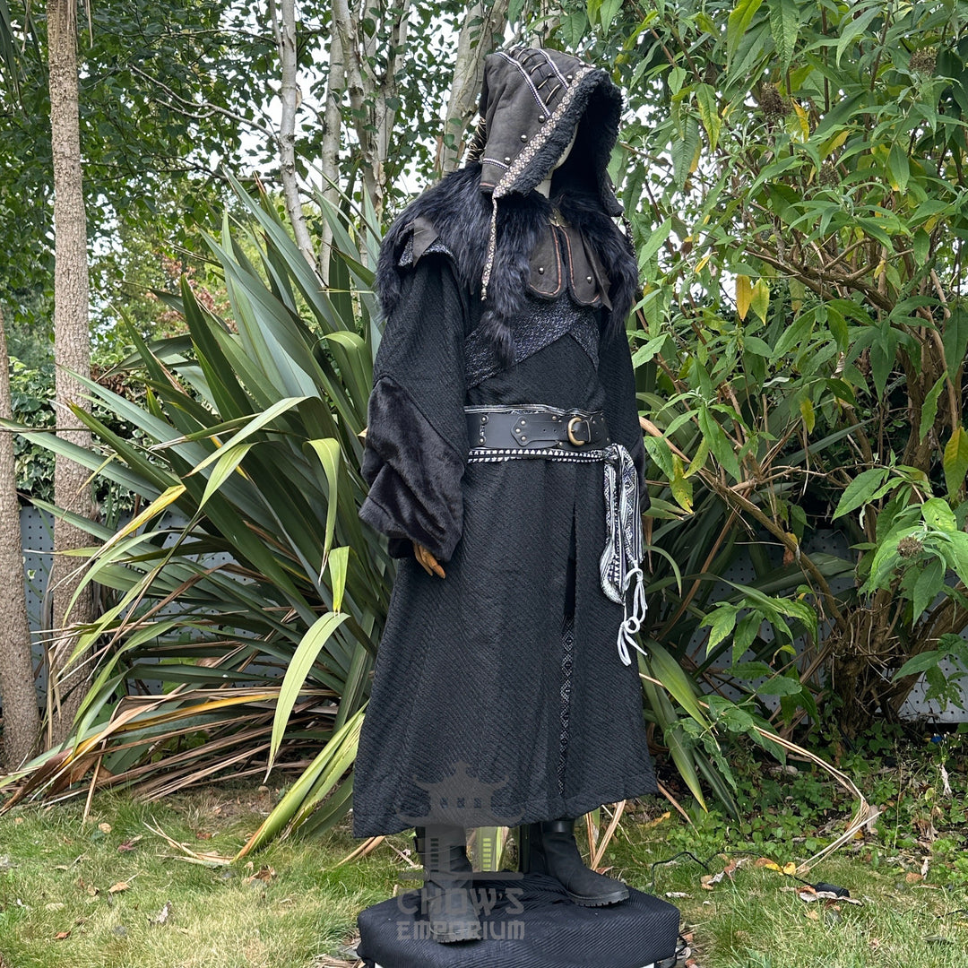 Medieval LARP costume side view featuring black robe, ornate hood, wool hood, belt and sash.