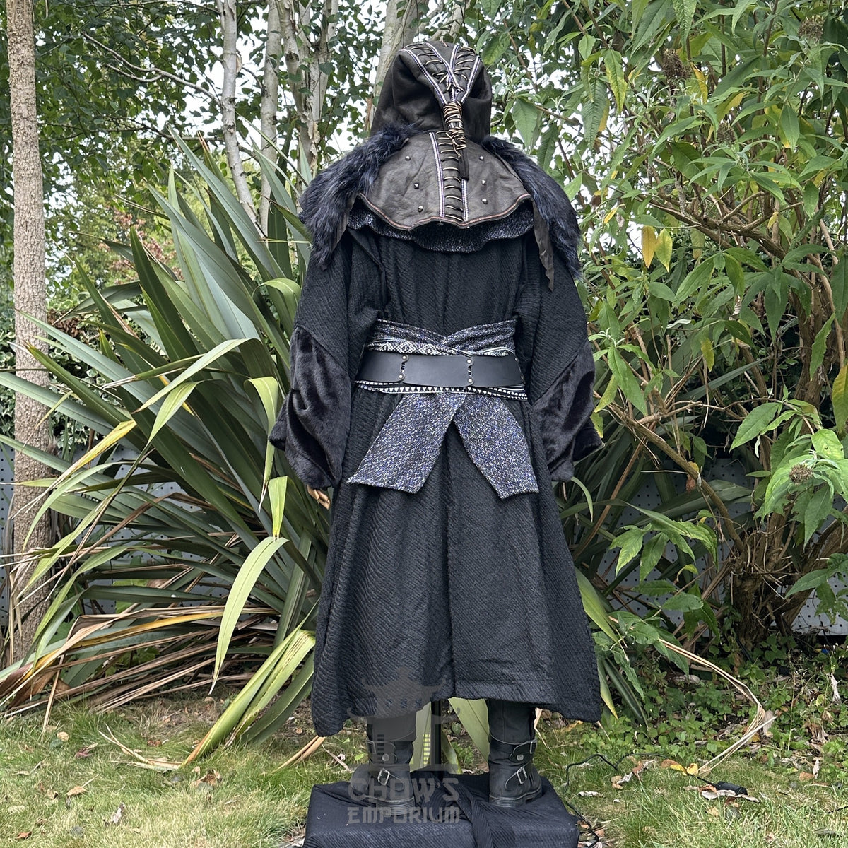 Medieval LARP costume back view featuring black robe, ornate hood, wool hood, belt and sash.