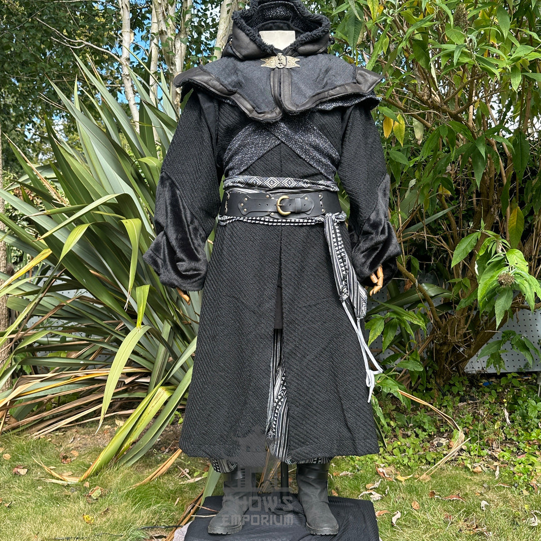 Medieval LARP costume front view, featuring a black robe, hood, arm wraps, belt and sash.