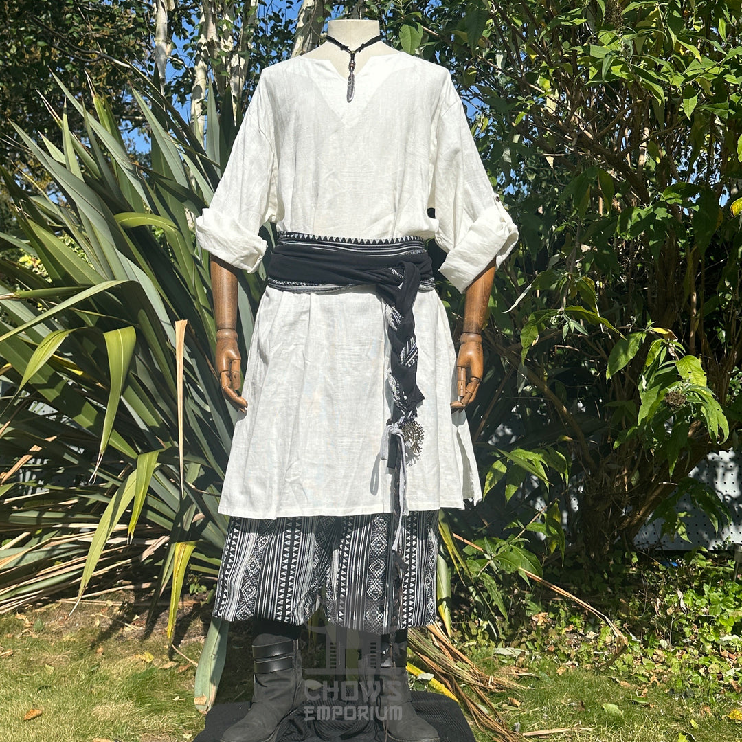 Medieval LARP outfit front view, featuring a white tunic, black and white trousers and matching.