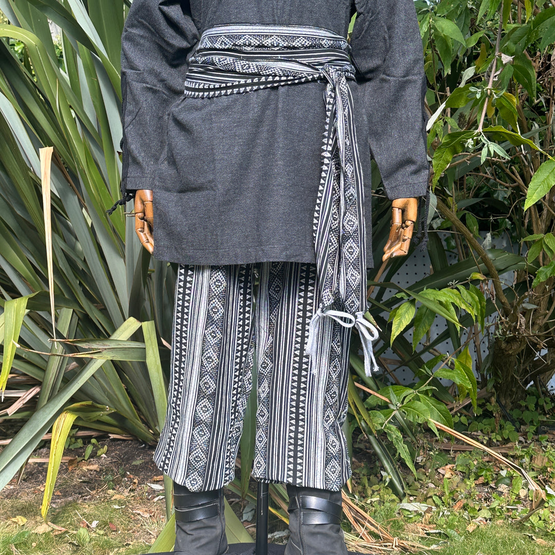 Black shirt with striped trousers and sash for LARP or medieval events.