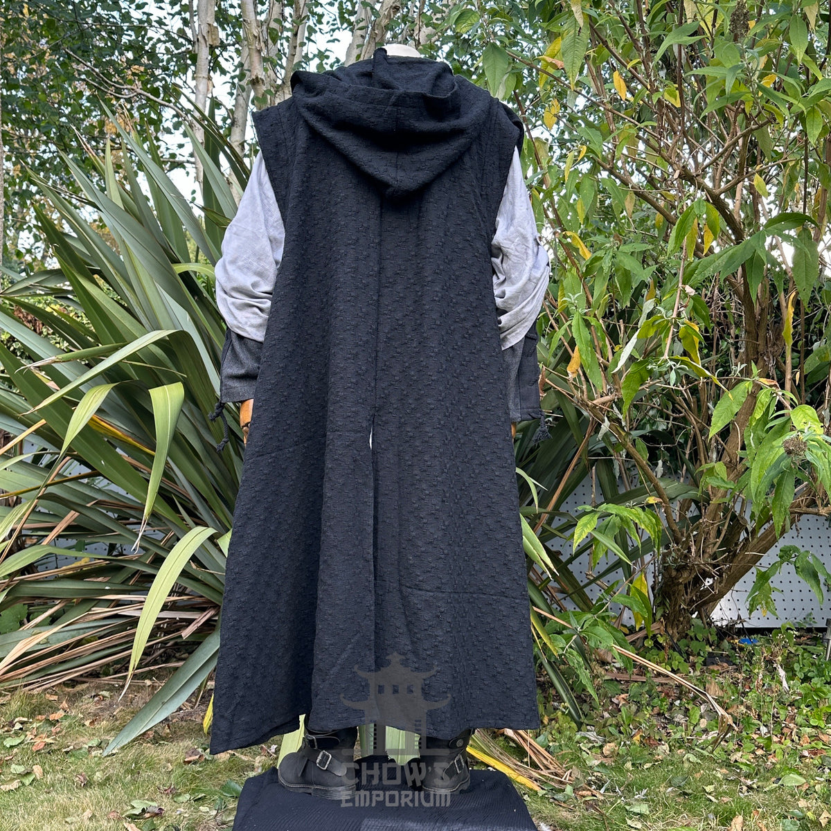 Medieval LARP outfit back view, featuring a black hooded robe, grey tunic, and sash.