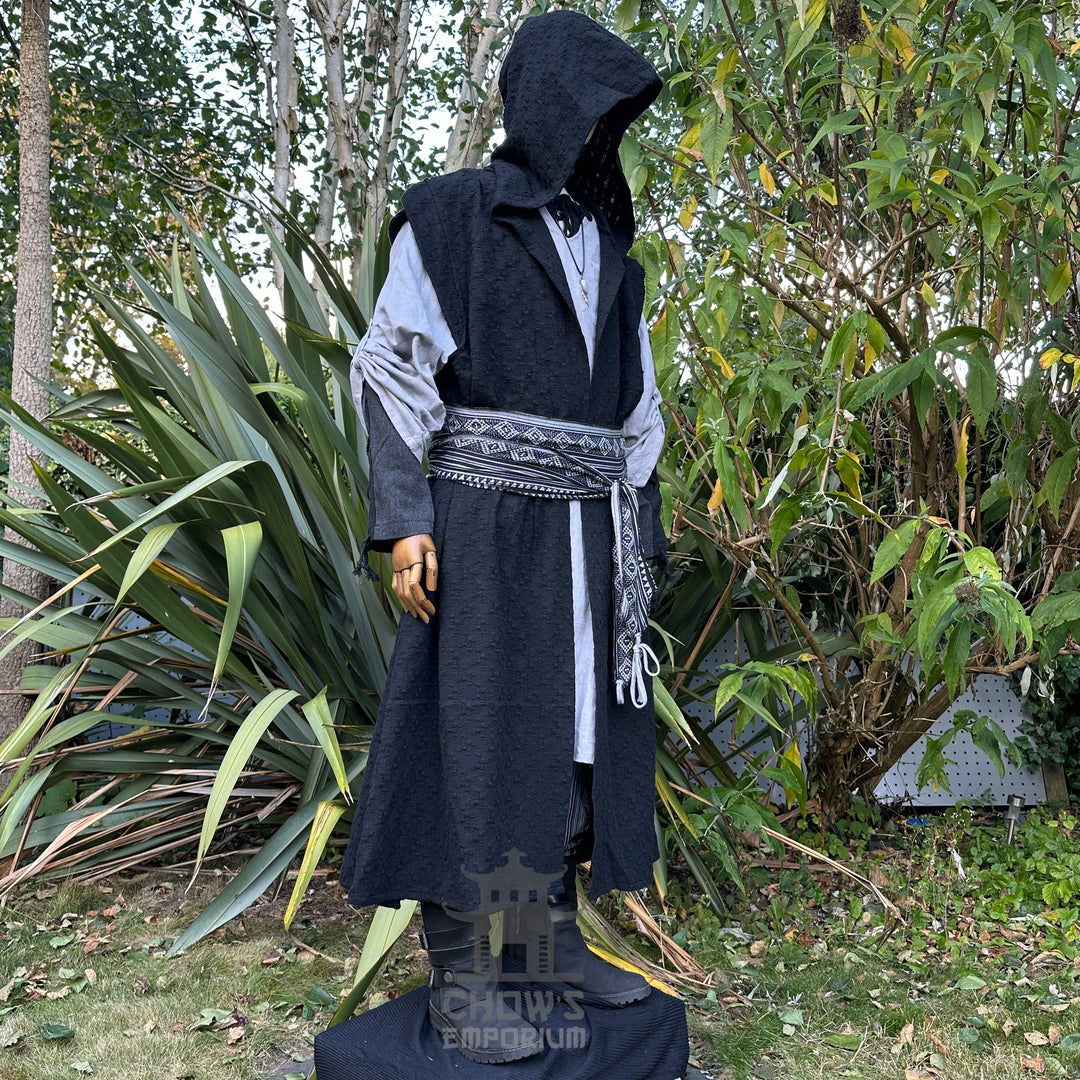 Viking LARP set: black hooded robe, grey tunic, patterned sash. Front view.