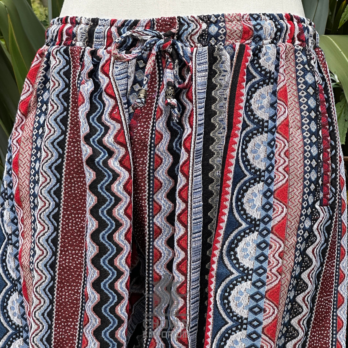Nordic zigzag medieval pants, red and blue cotton weave, front angle, for LARP.