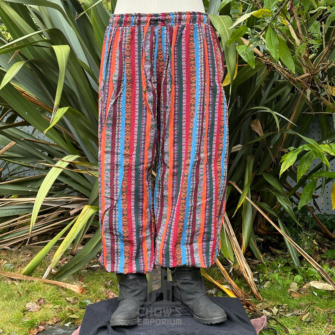 Front view of multi-color medieval hero trousers with elastic waist and ankle cuffs.