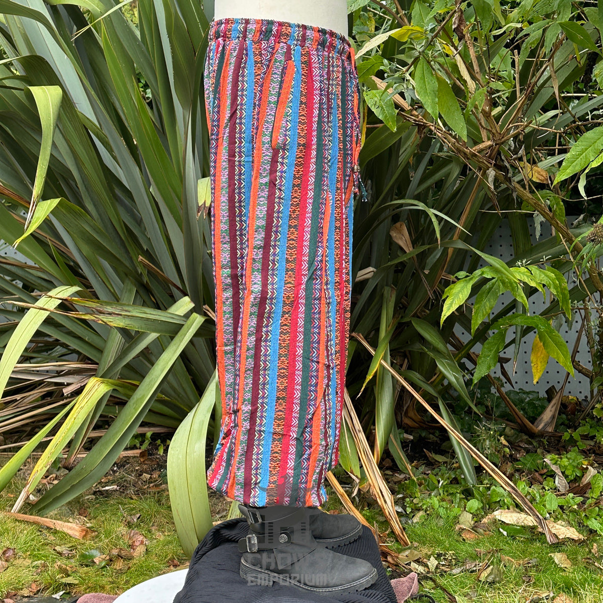 Side view of multicolor cotton hero trousers with decorative cord waist tie.