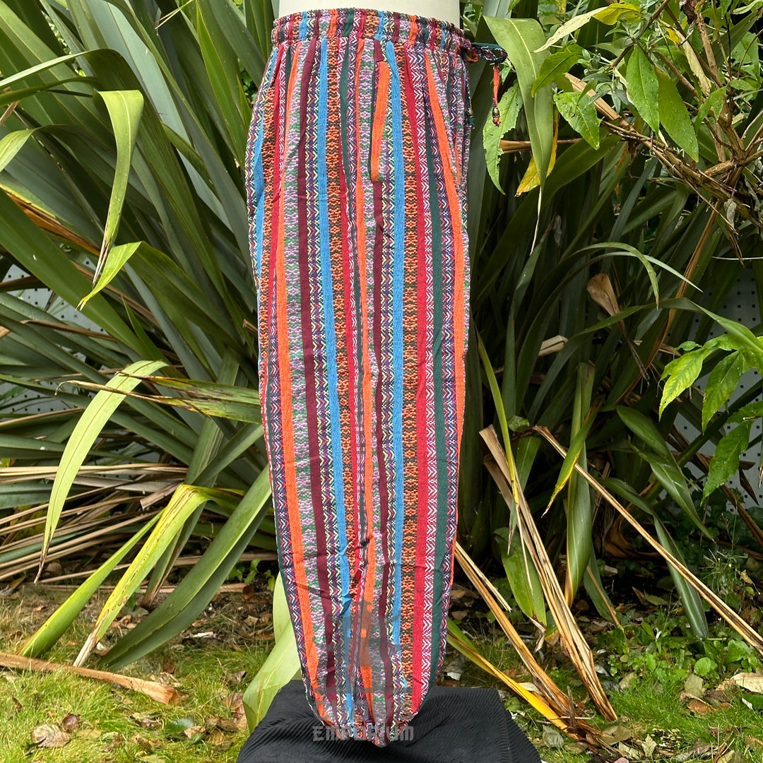 Side view of multicolor cotton hero trousers with decorative cord waist tie no boots.