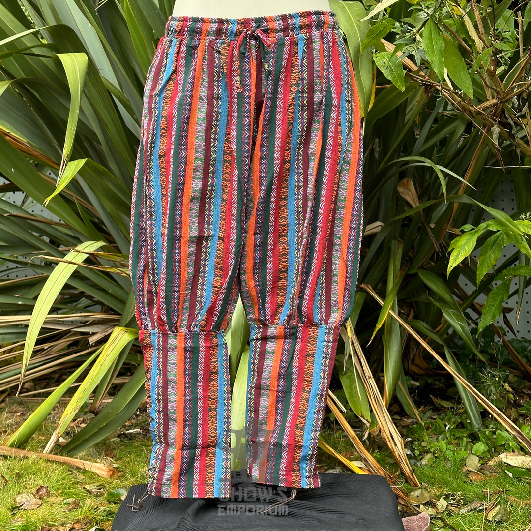 Front view of multi-color Viking trousers with crossover lacing and relaxed fit no boots.